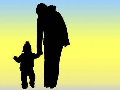 silhouette of parent holding child's hand