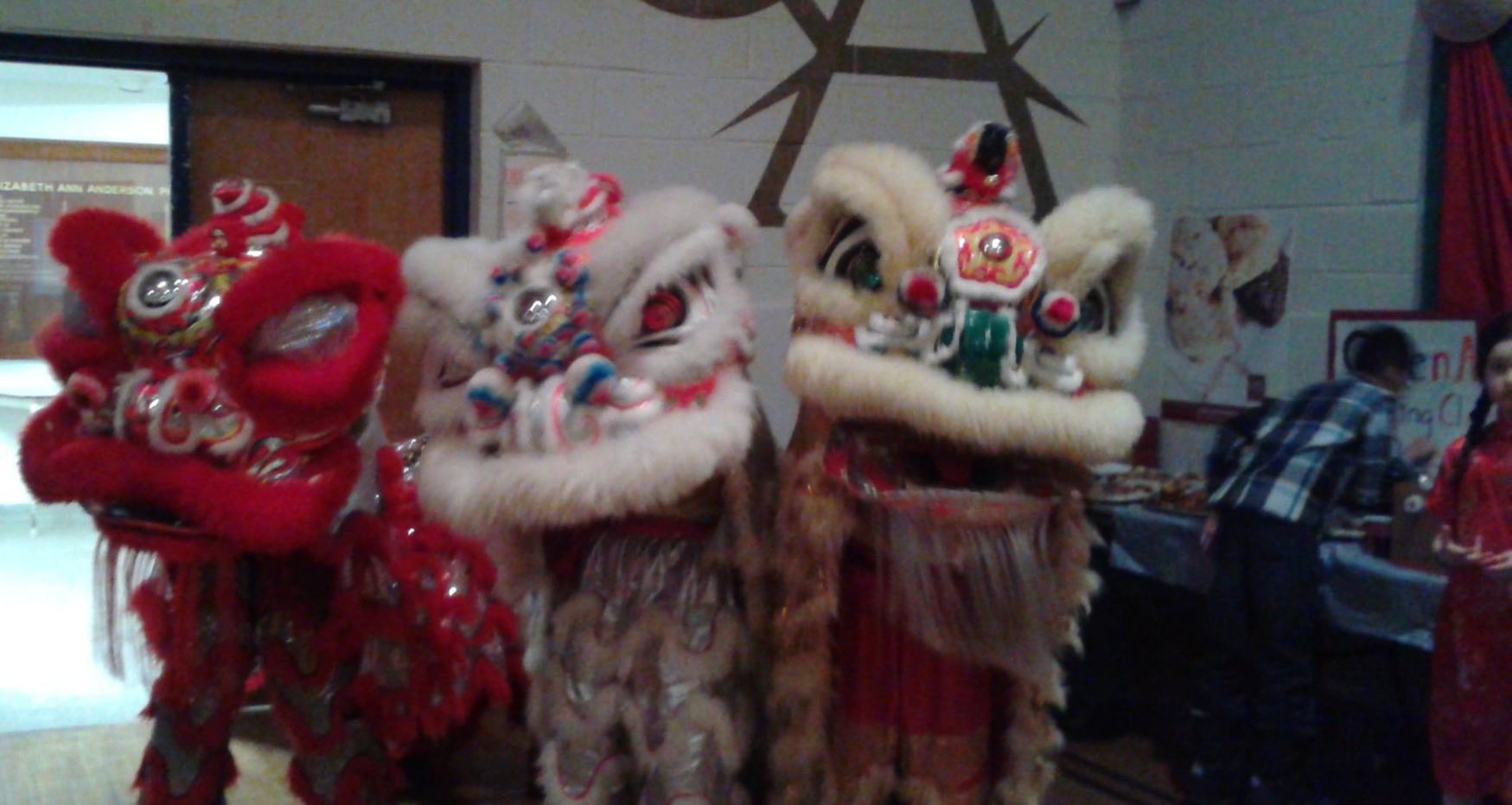 Students in lion dance costumes