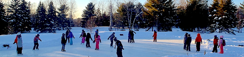 Students ice skating on the pond at SOES