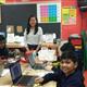 students smiling for the camera while working on their circuits at Makey Makey