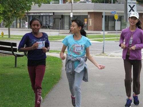 three students running during the Terry Fox run