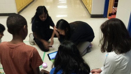students working on an ipad