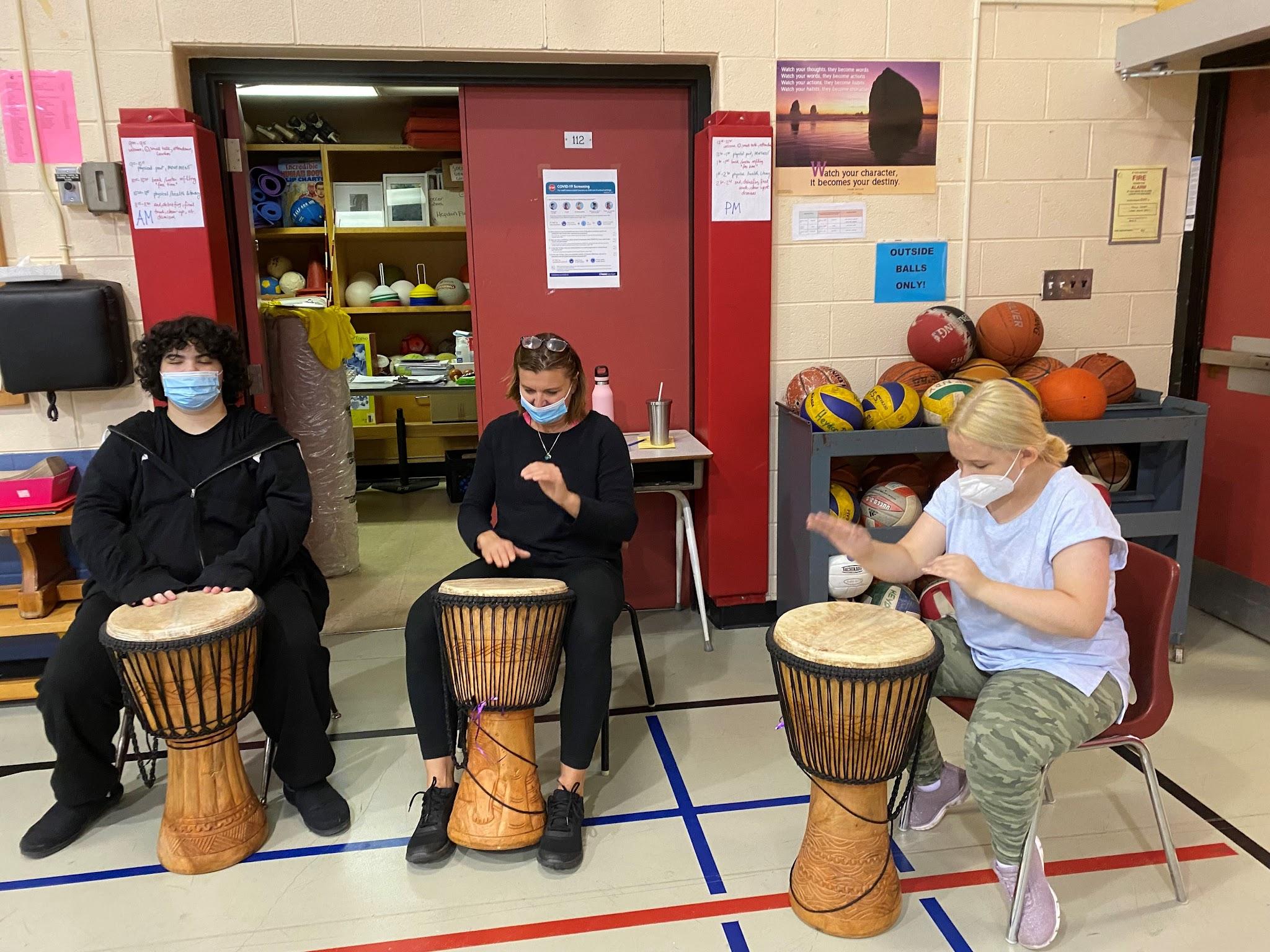 Students playing musical instrument. Open Gallery