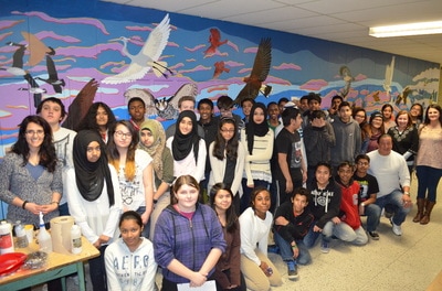 Class picture in front of mural Open Gallery