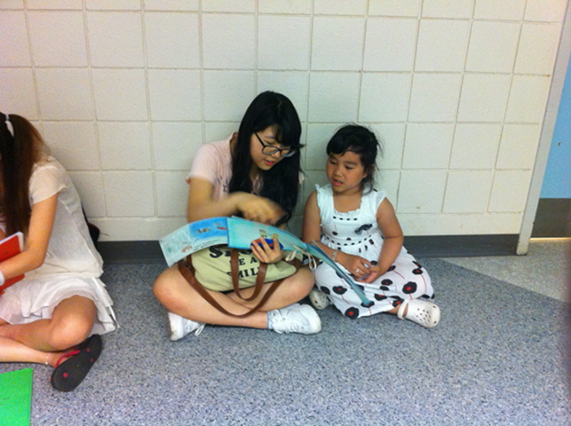 ESL Students reading to elementary students Open Gallery