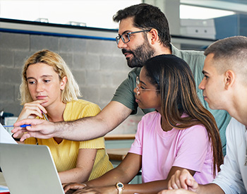 Tech savvy teens are shown the digital ropes by their teacher