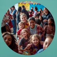 A group of children and adults at an event in a classroom smiling for the camera