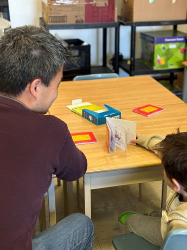volunteer reading with a student