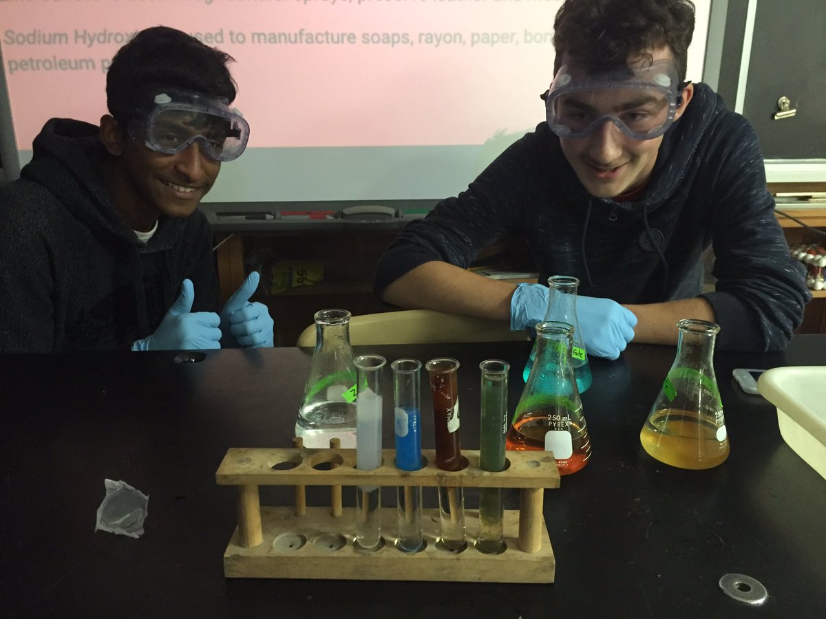 students doing chemistry experiment