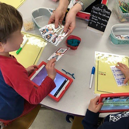 student selecting a card