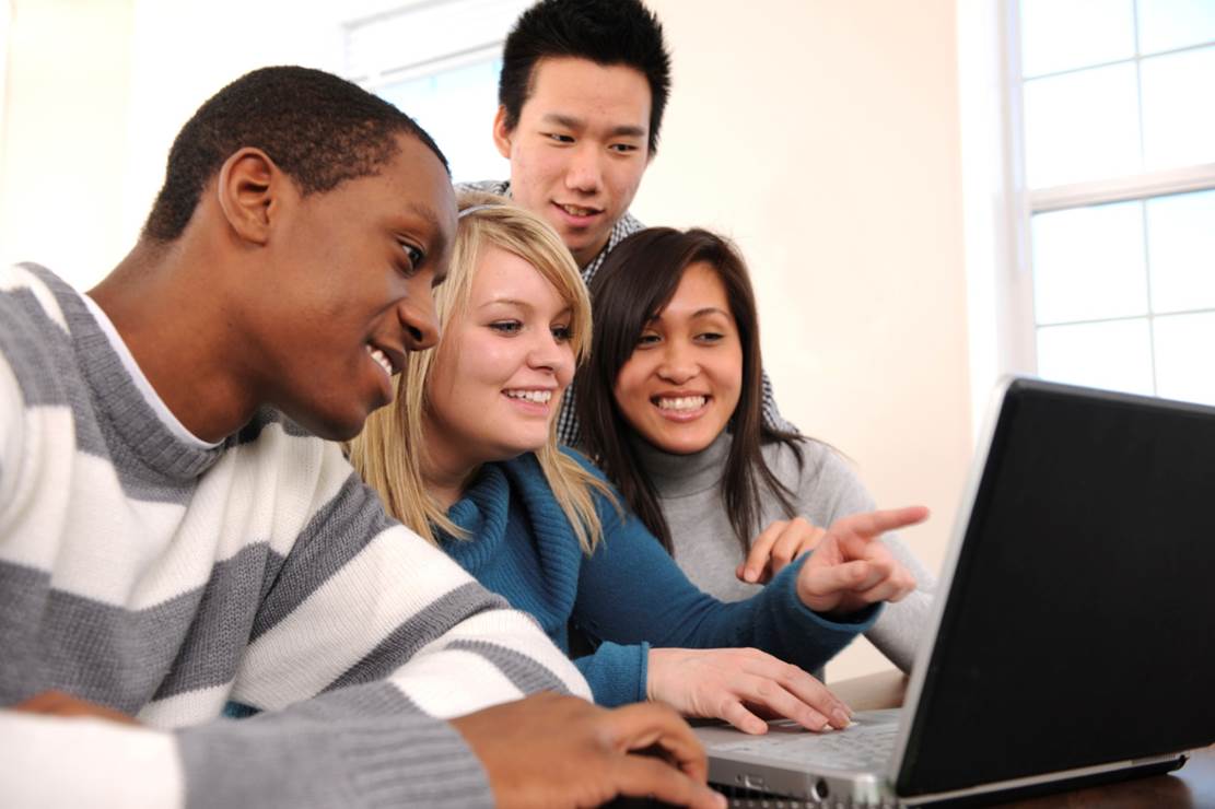Group of students play computer