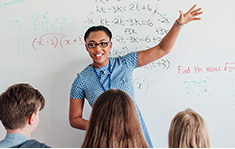 An energized teacher commands the attention of her young math students
