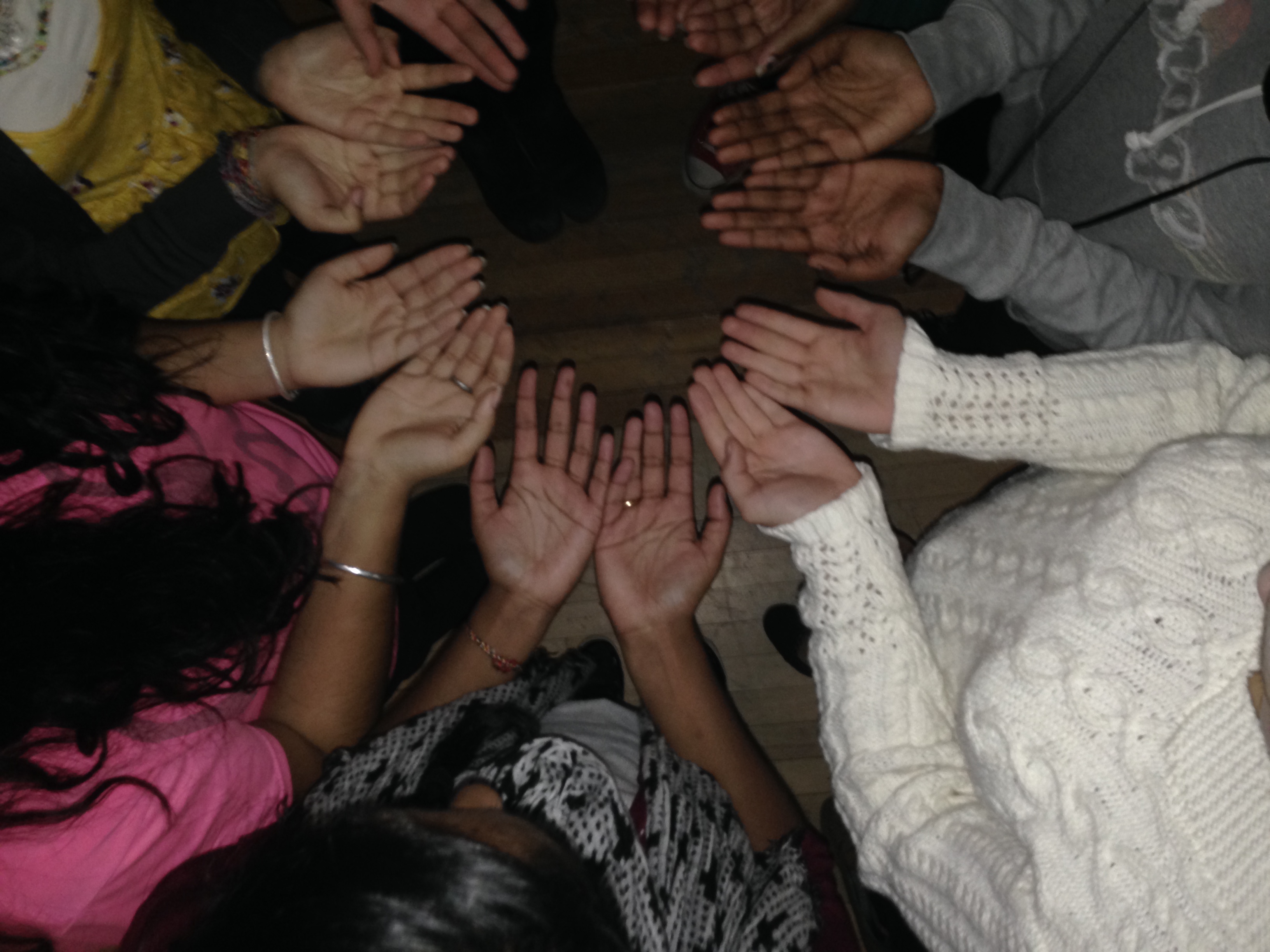 students hands in circle