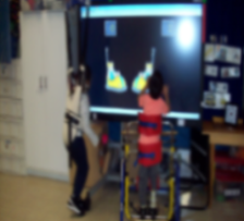 students playing on smart board