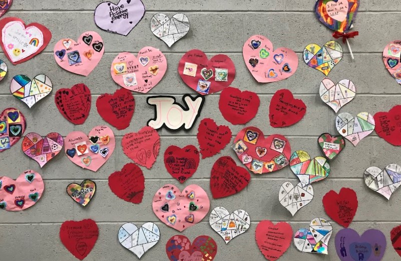 Student created hears with messages of joy