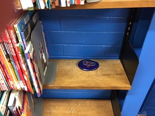 Kindness rock on shelf